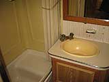 The bath has a seat and is adequate.